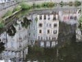River with reflection of buildings in Karlovy Vary, Czech Republic