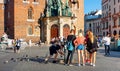 Summer cityscape, street photography next to Saint MaryÃ¢â¬â¢s Basilica on the Main Market Square in Krakow Royalty Free Stock Photo