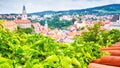 Summer cityscape - top view from the tiled roof to the Old Town of Cesky Krumlov Royalty Free Stock Photo