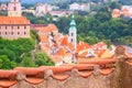 Summer cityscape - top view from the tiled roof to the Old Town of Cesky Krumlov Royalty Free Stock Photo