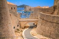 Summer cityscape - view of the bridge between the Revelin Fortress and the Ploce Gate in the Old Town of Dubrovnik Royalty Free Stock Photo