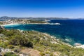 Summer, Cliff Top View Looking Down on Cala Batistoni Beach and Baia Sardinia Village with Surrounding Countryside. Royalty Free Stock Photo