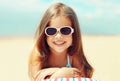 Summer close-up portrait smiling child little girl lying on beach Royalty Free Stock Photo