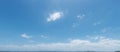 Summer clouds in blue sky over landscape, panorama format. Royalty Free Stock Photo