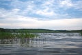 Summer cloudy day on a pond landscape.