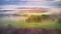 Summer cloudy rainy foggy morning panorama. Rural misty river, fields, meadow, village Royalty Free Stock Photo