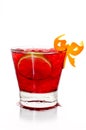 Summer cocktail in transparent glass with cherry, lime, and ice Royalty Free Stock Photo