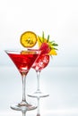 Summer cocktails decorated with tropicl fruits and leaves on a r Royalty Free Stock Photo