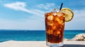 Summer cocktails, sea resort concept. Glass of iced tea. Long island cocktail on tropical beach Royalty Free Stock Photo