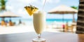 Summer coconut milk cocktail with pineapple on a table in a cafe on the beach. Pina colada Royalty Free Stock Photo