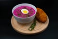 Summer cold beetrot soup (choldnik) with boiled egg with a croissant Royalty Free Stock Photo