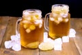 Summer Cold Ice Tea with Citrus and Ice Cube in Glass Jar Wooden Background Close Up Cold Summer Beverage Royalty Free Stock Photo