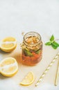 Summer cold Iced tea with lemon and herbs, copy space Royalty Free Stock Photo