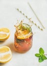 Summer cold Iced tea with lemon and herbs, vertical composition Royalty Free Stock Photo