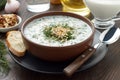 Summer cold soup tarator with yogurt, cucumber, dill and walnuts ready to eat.