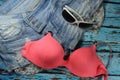 Summer collage - jeans shorts, bikini bra and sunglasses Royalty Free Stock Photo