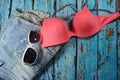 Summer collage - jeans shorts, bikini bra and sunglasses Royalty Free Stock Photo