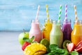 Summer colorful fruit smoothies in jars with ingredients. Healthy, detox and diet food concept Royalty Free Stock Photo