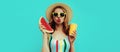 Summer colorful portrait beautiful young woman blowing her lips with slice of watermelon and cup of juice wearing a straw hat Royalty Free Stock Photo