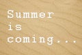 Summer is coming... written on sandy background. Royalty Free Stock Photo