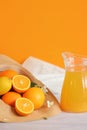 Citrus fruits and juice in a carafe. Ripe oranges in a summer hat Royalty Free Stock Photo