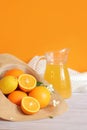 Summer composition with citrus fruits and juice in a carafe Royalty Free Stock Photo