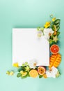 Summer composition with fruits and flowers on blue background