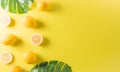 Summer composition made from oranges, lemon or lime on pastel yellow background. Fruit minimal concept. Flat lay, top view, copy