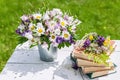 Summer composition. Old books, bouquet of wild flowers on a rustic background Royalty Free Stock Photo