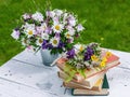 Summer composition. Old books, bouquet of wild flowers on a rustic background Royalty Free Stock Photo