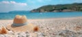 Summer composition on sandy beach with hat at blue sea as background. Summer vacation concept Royalty Free Stock Photo