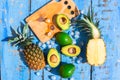 Summer composition with tropical fruits avocado and pineapple Royalty Free Stock Photo