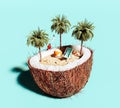 Summer concept background. Half of coconut with beach chair and palm trees
