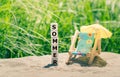 Summer concept. Dice placed on a beach form the German word `sommer` Royalty Free Stock Photo