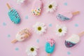 Summer concept. Flat lay with flowers. White wildflowers and ice cream on a pink background. Creative image