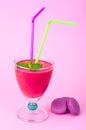 Summer concept. Fruity pink smoothies on bright colored background