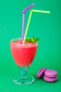 Summer concept. Fruity pink smoothies on bright colored background