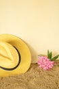 summer concept.hat on a sand with tropic sea flowers Royalty Free Stock Photo