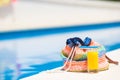 Summer concept-straw bag, tasty orange juice near Royalty Free Stock Photo