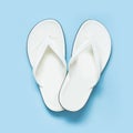 Summer concept. White flip flops over blue background. Top view. Royalty Free Stock Photo