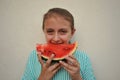 Summer concept with young girl eating a watermelon Royalty Free Stock Photo