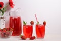 Summer cooling drink with strawberries and ice on a white background with copy space