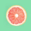 Summer coral grapefruit slice. Isolated white background Royalty Free Stock Photo