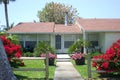 Summer cottage with red bougainvillae Royalty Free Stock Photo