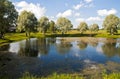 Summer country landscape with pond.