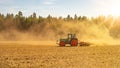 Summer countryside / agriculture harvest forest background banner panorama: old tractor milling straw grain barley wheat field, Royalty Free Stock Photo