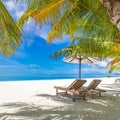 Summer couple destination scenic beach beds chairs umbrella palms. Love romantic travel landscape Royalty Free Stock Photo