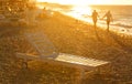 Summer couple holding hands at sunset on beach. Romantic young enjoying sun, sunshine, romance and love by sea. vacation trave Royalty Free Stock Photo