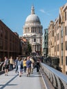 Summer crowds surge across the Millennium Bridge toward St. Paul Royalty Free Stock Photo