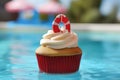 Summer cupcake with swimming pool defocused background. AI generative